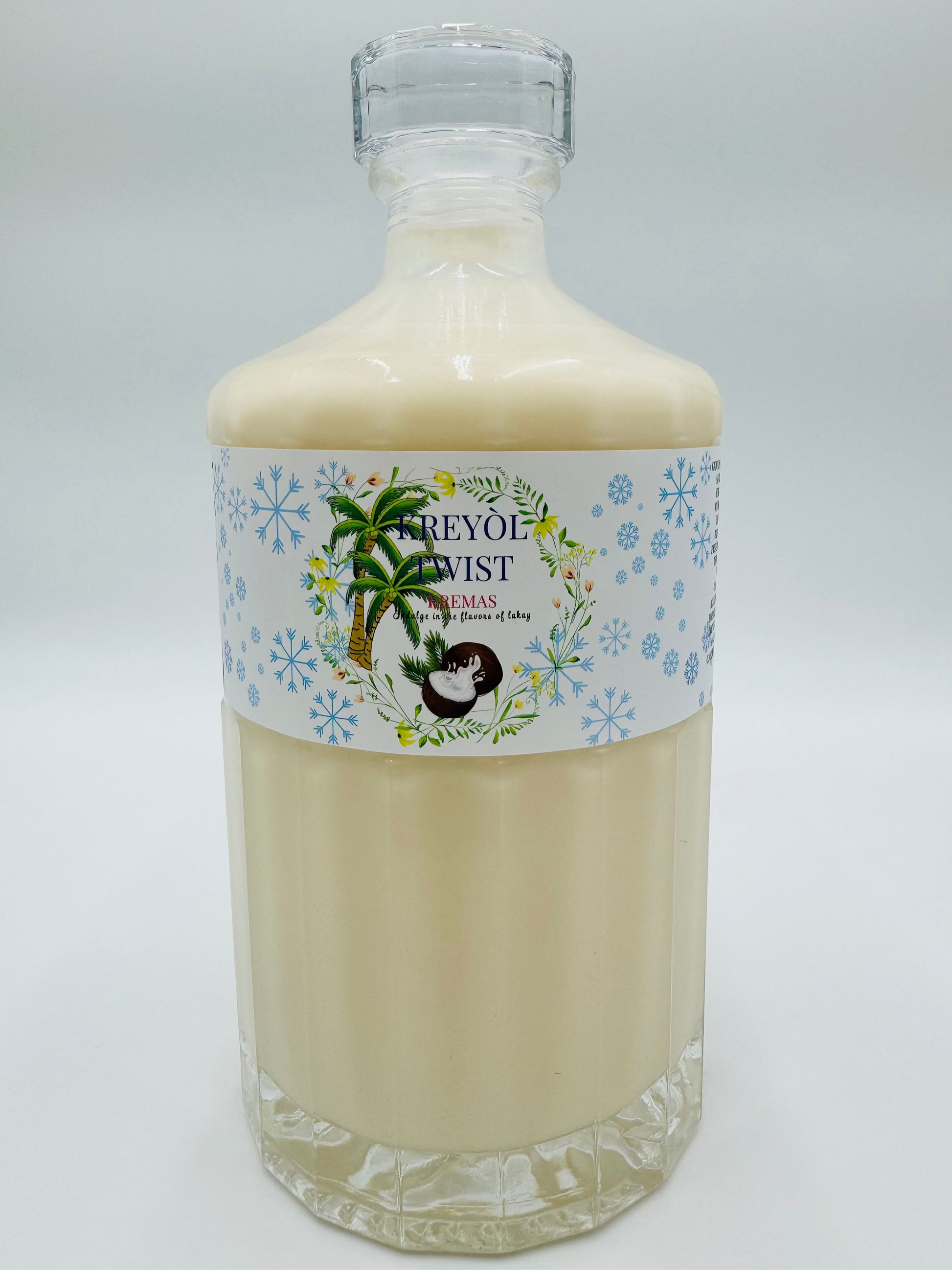 Bottle of Kreyól Twist Kremas with a decorative label on a white background