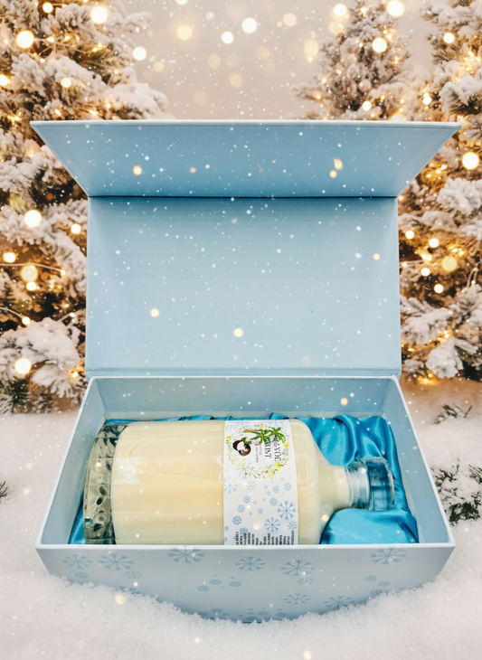 Gift box with Kremas bottle inside against a festive background